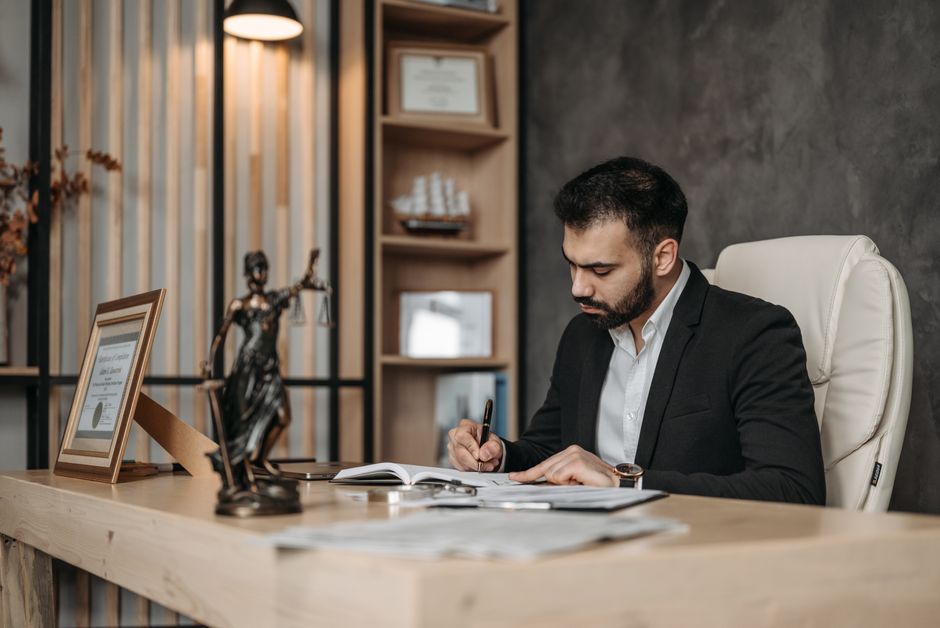 Professional bail bondsman working at desk with legal documents - bail bond south carolina